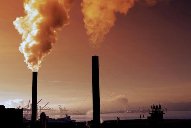 Pipes pumping smoke pollution into the air
